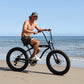 Tracer Avalon GT7 29" Beach Cruiser Bikes in black riding on beach